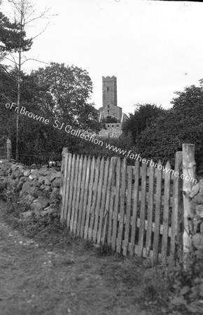 GLIMPSE OF ABBEY TOWER FROM VILLAGE HEART